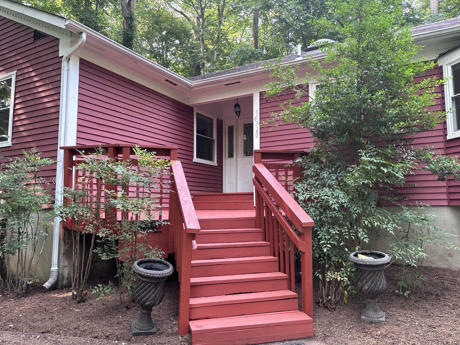 Exterior red house and deck painting